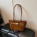 Chic brown suede-textured tote bag featuring elegant silver buckle and slim shoulder straps - Brown