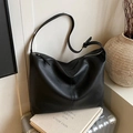 Minimalist black lychee texture leather shoulder bag with adjustable strap for women - Black