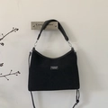 Detail of black matte shoulder bag with Lazy Breeze brand patch and adjustable strap - Black Large