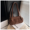 Detailed view of brown suede shoulder bag with dual leather straps and metal hardware - Brown