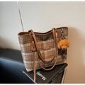 Detail of plaid wool tote bag with brown leather handles and poodle plush charm - Coffee Plaid With Pendant