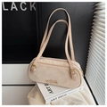 Detail of beige suede Boston bag featuring slim shoulder straps and metal logo hardware - Beige Grey