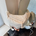 Cream white nylon dumpling crossbody bag with textured fabric and woven rope zippers - Off White