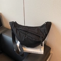 Minimalist black crescent moon shoulder bag in matte nylon with adjustable strap - Black