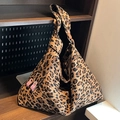 Large leopard print canvas tote bag with pink leather buckles and wide shoulder strap - Brown
