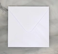 Close-up of premium white square paper envelope with flap on elegant marble surface - Pearl Ice White Square