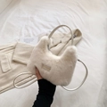 Detail of white faux fur handbag featuring love every day metal tag and leather strap - White