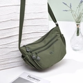 Detail of army green waterproof nylon crossbody bag with multiple zipper layers and side pockets - Green