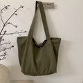 Detail view of large olive green canvas tote bag with sturdy long shoulder straps - Green
