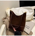 Detailed shot of coffee brown suede and leather bucket bag with top handle design - Brown