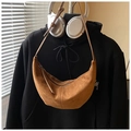 Detail of brown faux suede hobo bag featuring a metal zipper and long leather puller - Brown