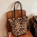 Plush leopard print tote bag with brown leather handles and fuzzy faux fur texture - Leopard Print