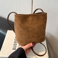 Caramel brown faux suede mini bucket bag with circular leather top handle for autumn style - Brown