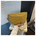 Detail view of mustard yellow corduroy crescent bag with geometric woven strap - Yellow