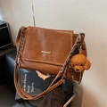Vintage brown pebbled leather shoulder bag with gold metal trim and poodle charm - With Charm / Brown