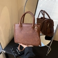 Vintage brown leather handbag with round top handles and adjustable shoulder strap - No Pendant / Brown