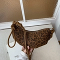 Leopard print hobo bag featuring a knotted shoulder strap and vintage fabric texture - Brown