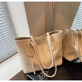 Detail of a minimalist cream leather tote bag with elegant long shoulder straps - Off White