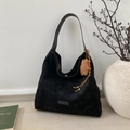 Close-up of black suede tote bag featuring a teddy bear charm on minimalist background - Black with Pendant
