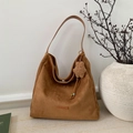 Detail of brown suede tote bag with PANTOR leather logo and star plush charm - Brown with Pendant