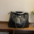 Large black quilted leather tote bag with gold chain strap and turn-lock closure - Black