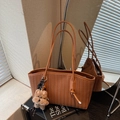 Brown woven tote bag with human hair pattern and plush puppy charm for women - Brown