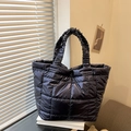 Quilted black puffer tote bag with glossy metallic finish and ruffled handles for women - Blue