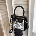 Contrast crossbody bag with black white landscape canvas and golden flower clasp - Black
