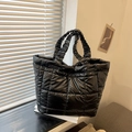 Glossy black quilted tote bag with designer ruched handles and spacious interior - Black