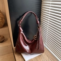 Glossy burgundy leather shoulder bag with decorative knot handle and tassel charm - Wine Red (With Pendant)