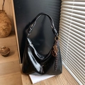Retro black glossy leather hobo bag with knotted shoulder strap and unique gold charm - Black (With Charm)