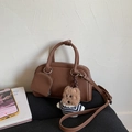 Brown faux leather Boston bag with teddy charm, mini pouch and CLEAROK branding detail - With Charm / Brown