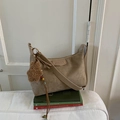 Khaki suede hobo shoulder bag with a cute bear charm and adjustable strap - Khaki