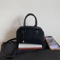 Black suede-finish boston bag with silver heart charm and adjustable shoulder strap - Black