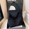 Large capacity black corduroy hobo shoulder bag with minimalist woven brand label - Black