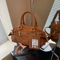 Vintage caramel brown bowling bag with multi-zipper texture and adjustable strap - Brown