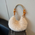 Crescent-shaped faux fur handbag in beige with decorative beaded rope handle - Khaki