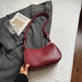 Retro burgundy hobo bag with knotted strap and gold logo in a stylish setting - Wine Red (No Pendant)