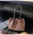 Detail of vintage matte brown tote bag showing textured leather and metal buckle hardware - Brown