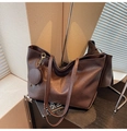 Dark brown leather tote bag with round pouch charm and gold hardware detail - Brown