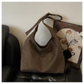 Detailed view of the soft brown suede fabric texture and adjustable shoulder strap buckle - Brown