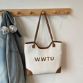 Beige woven tote bag with brown leather trim and WWTU logo detail for daily commuting - No Pendant / White