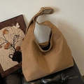 Brown faux suede hobo bag with wide shoulder strap and matte finish for women - Brown