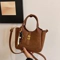 Brown suede bucket bag with wooden bead charm and elegant gold-tone hardware - With Charm / Brown