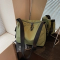 Green checkered canvas crossbody bag with adjustable black strap and dual zipper closure - Matcha Green
