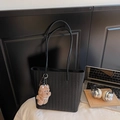 Retro black woven tote bag with slim leather straps and a brown teddy bear pendant - Black