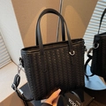Classic black woven bucket bag with double handles and detachable silver strap - Black