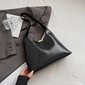 Chic black crescent bucket bag with glossy leather finish and gold metal accents - Black without Pendant