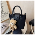 Detail of black suede mini bag with cute teddy bear charm and gold metal hardware - With Charm / Black