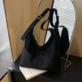 Minimalist black matte tote bag with adjustable wide strap and gold buckle detail - Black